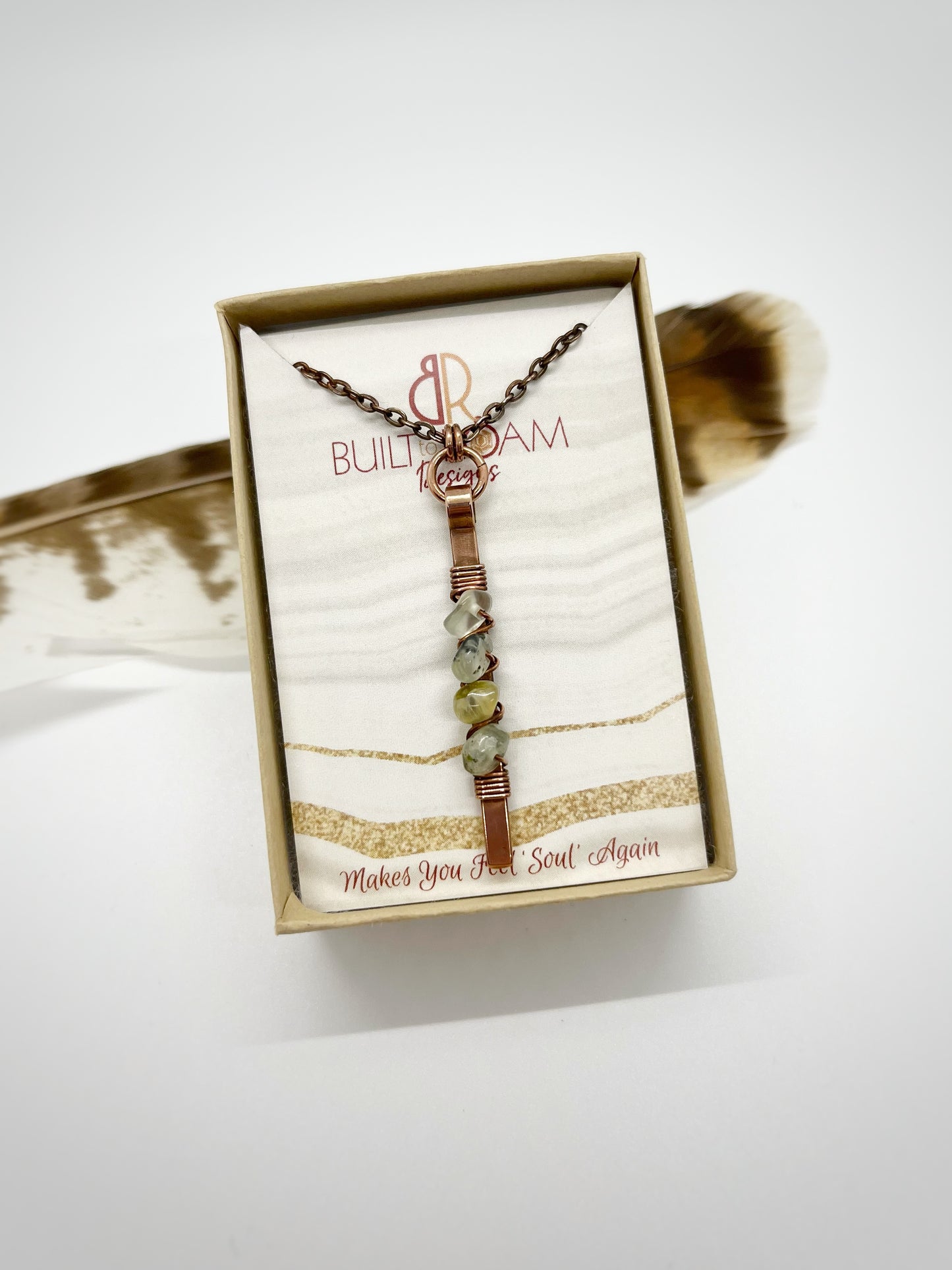 Copper bar necklace with green prehnite chip beads in a Built to Roam Designs jewelry box with white background - front view - Thrive