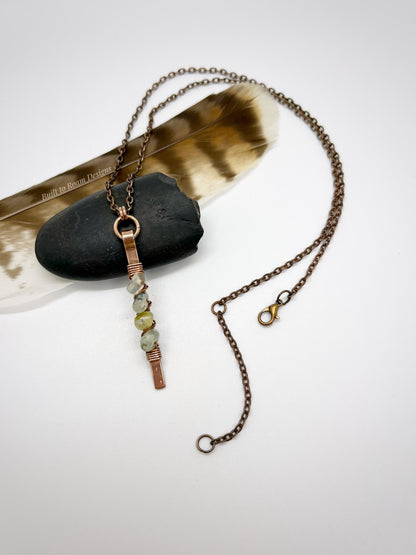 Copper bar necklace with green prehnite chip beads on white background - front view - Thrive 