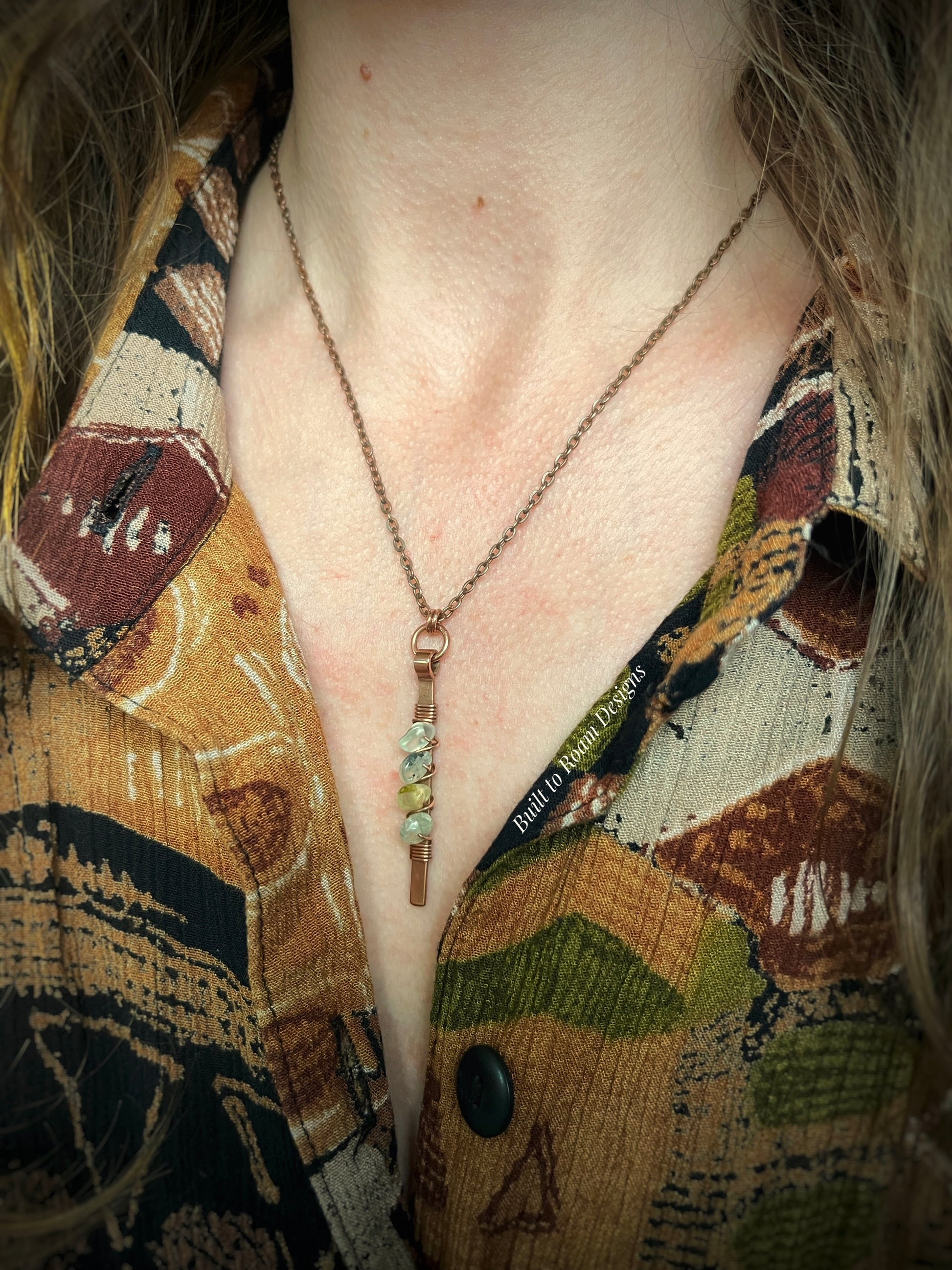 Person wearing a copper bar necklace with green prehnite chip beads - side view - Thrive 
