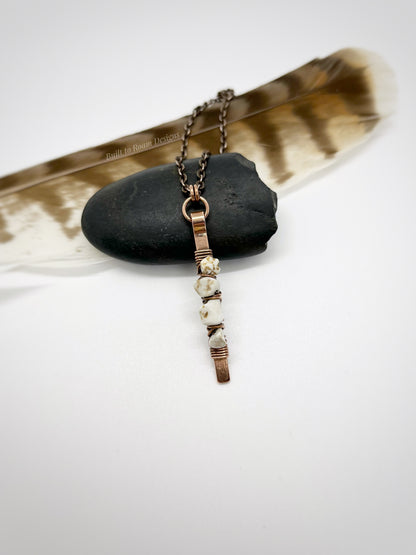 Copper bar necklace with white turquoise chip beads on a rock - front view - Horizon 