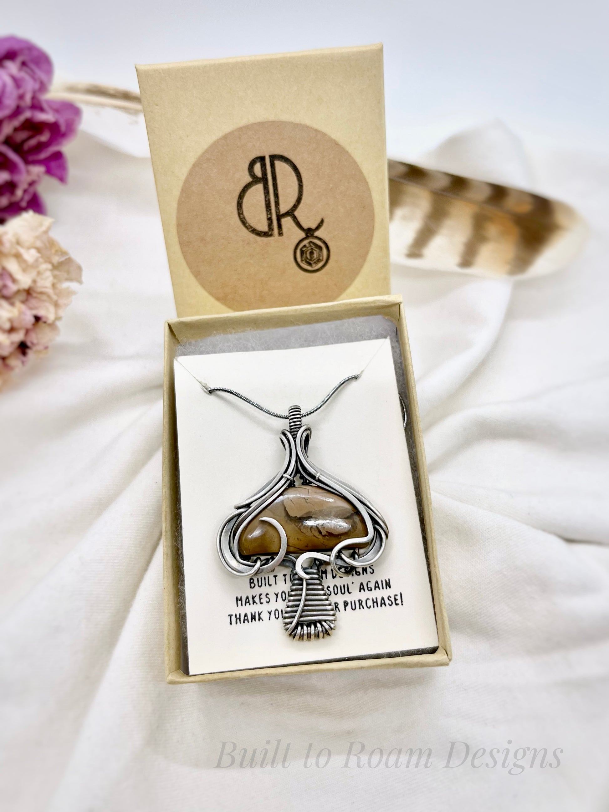 Silver mushroom-shaped pendant with a brown Mookaite Jasper gemstone in a Built to Roam Designs jewelry box - front view