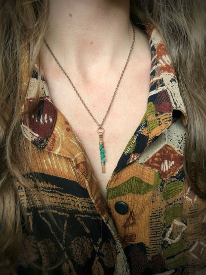 Person wearing a Copper bar necklace with teal amazonite chip beads - side view - Origin