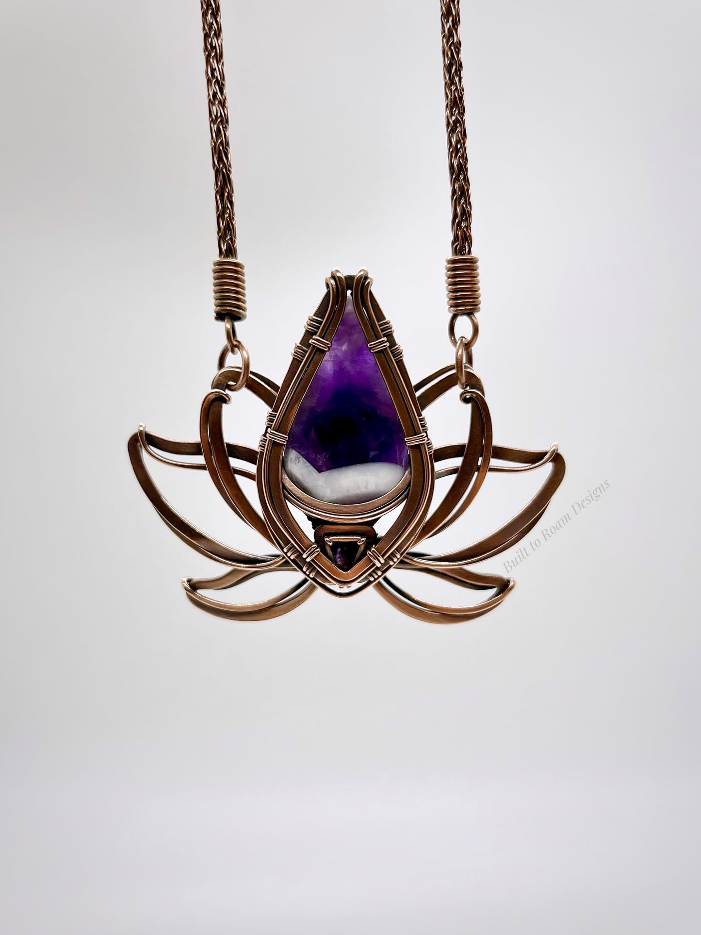 Copper lotus flower Viking knit chain necklace with purple amethyst gemstone on white background - front view - Elysian
