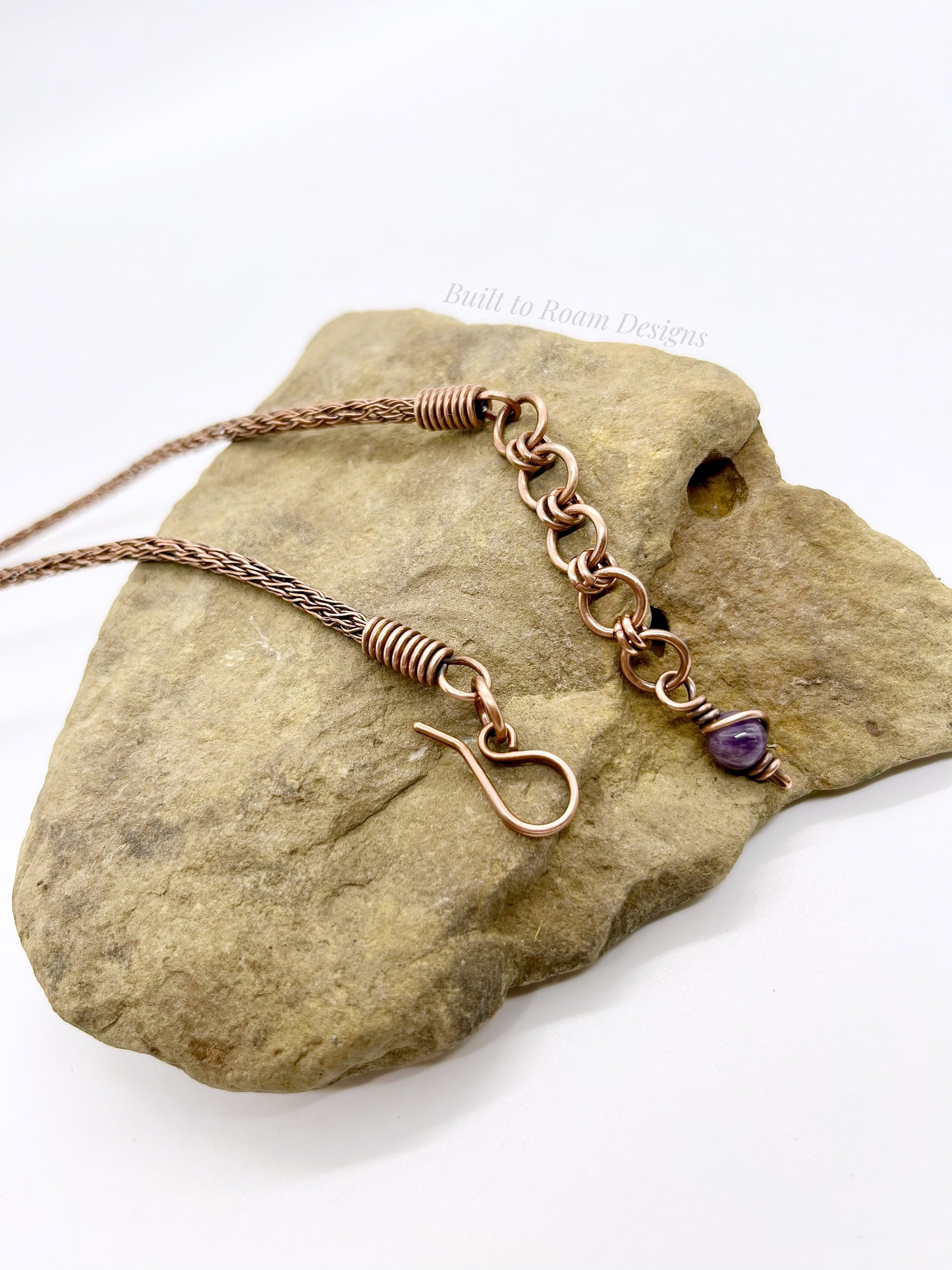 Copper necklace with a purple purple gemstone on a rock - picture of clasp and jump rings
