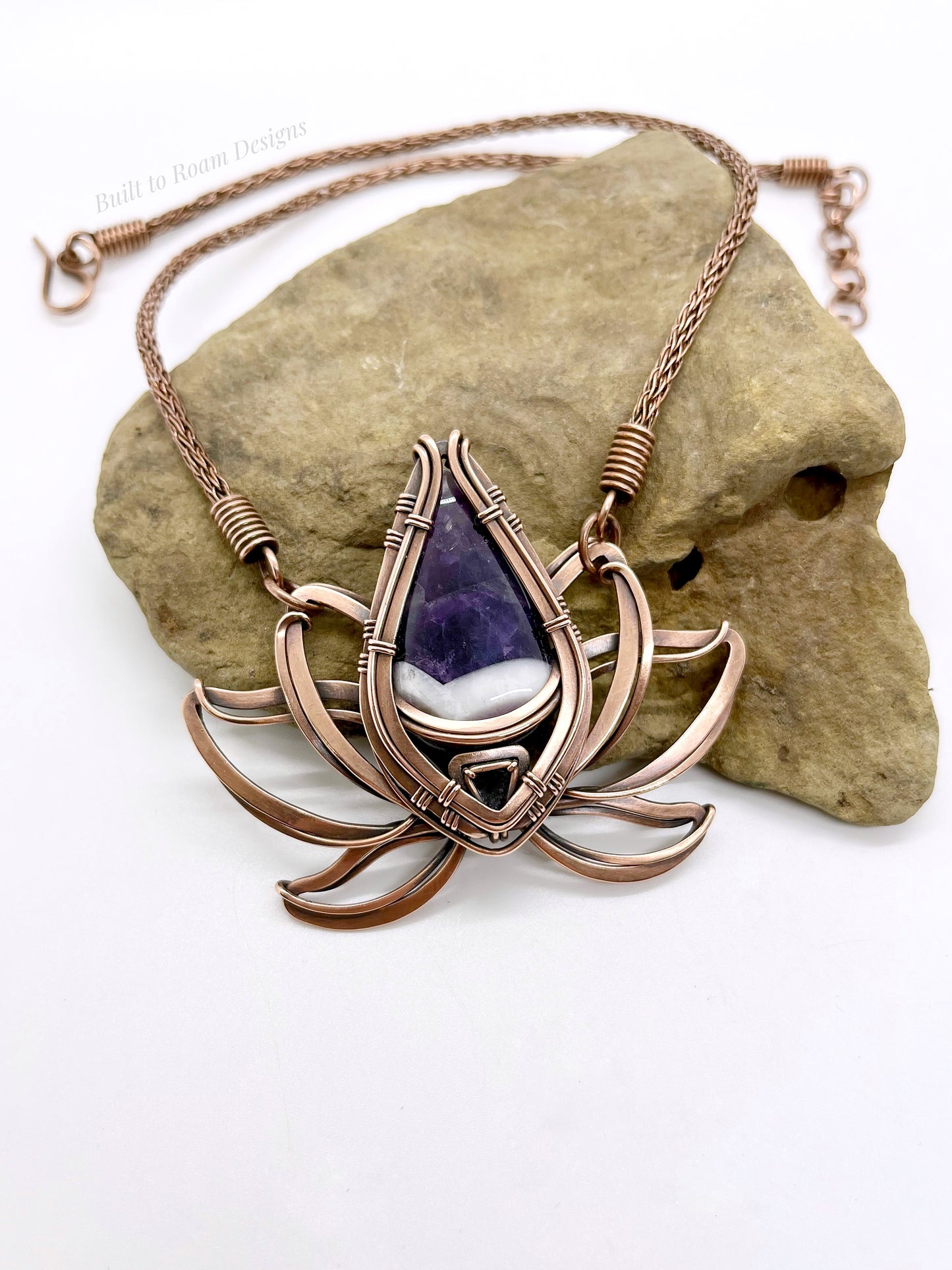 Copper lotus flower Viking knit chain necklace with purple amethyst gemstone on a rock - Elysian