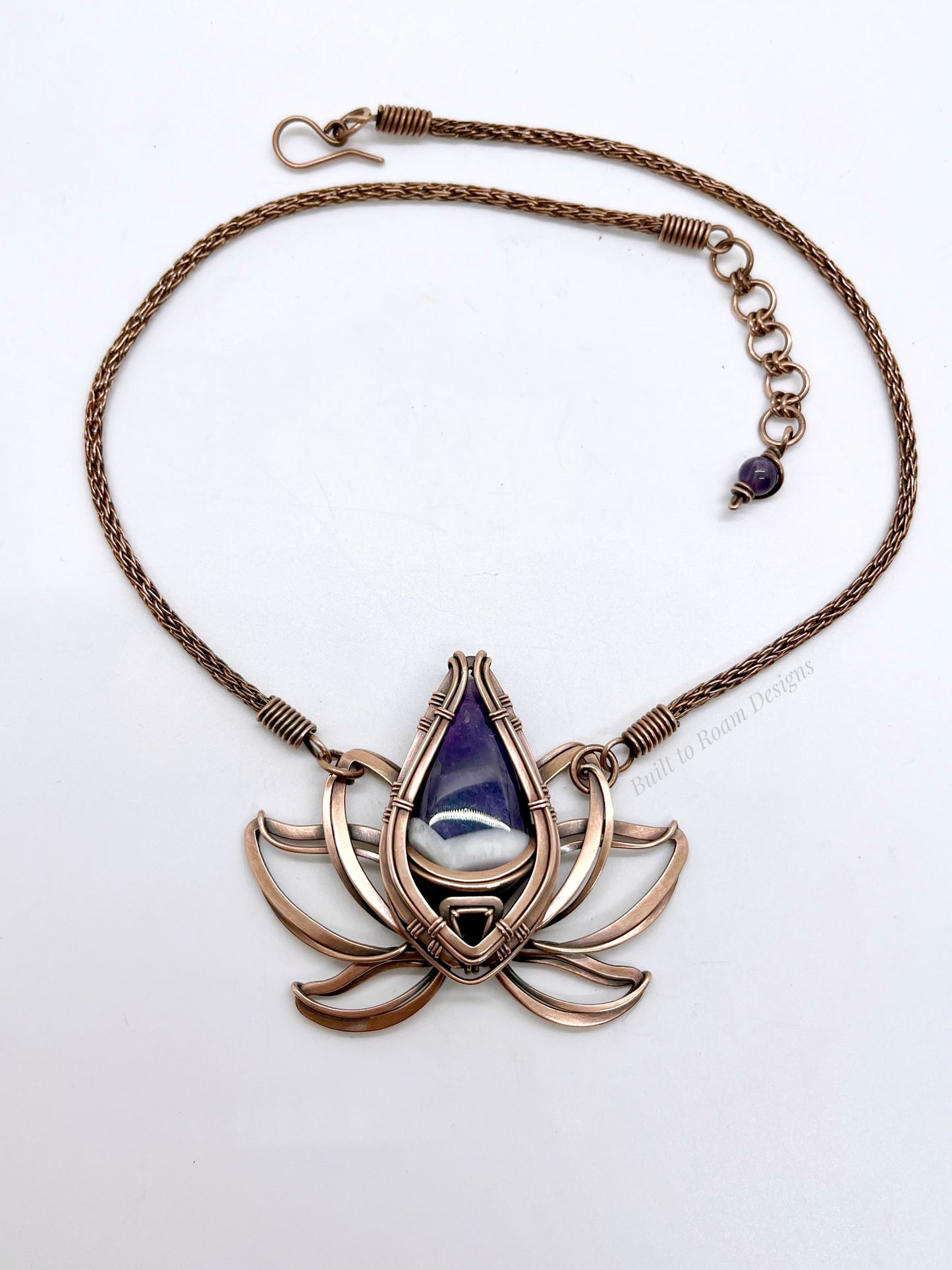 Copper lotus flower Viking knit chain necklace with purple amethyst gemstone on white background - front view - Elysian