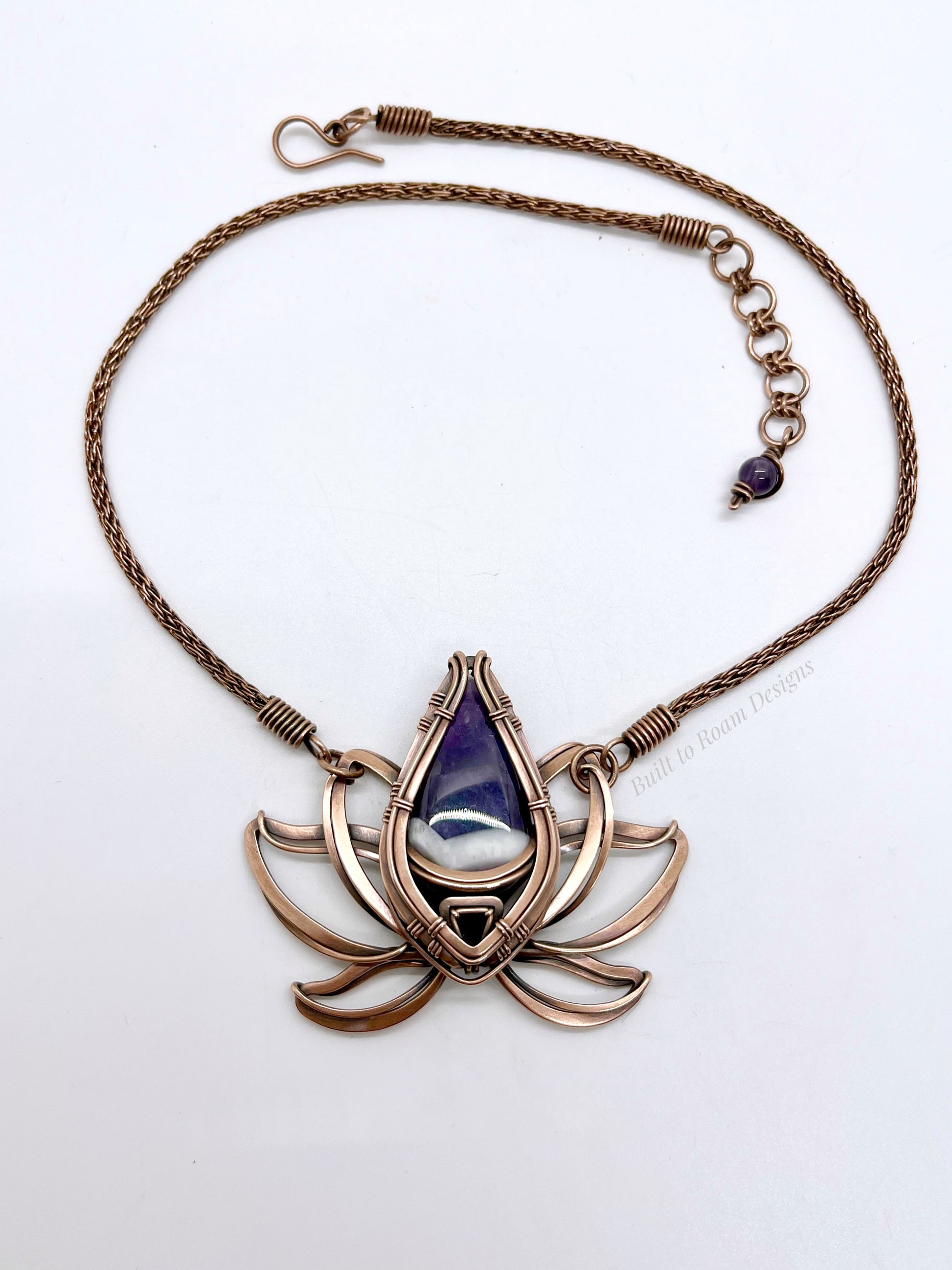 Copper lotus flower Viking knit chain necklace with purple amethyst gemstone on white background - front view - Elysian