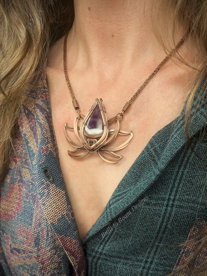 Copper lotus flower Viking knit chain necklace with purple amethyst gemstone on a person - Elysian